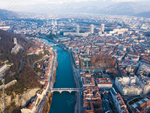 Aerial view Grenoble of city center with embankment of Isere river, France photo