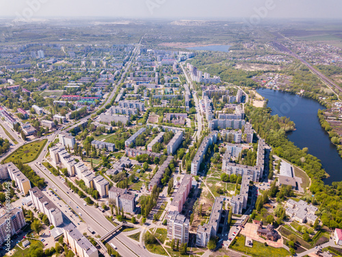 Aerial panoramic view of Stary Oskol cityscape overlooking Cathedral of Alexander Nevsky on bank of Oskol River, Russia