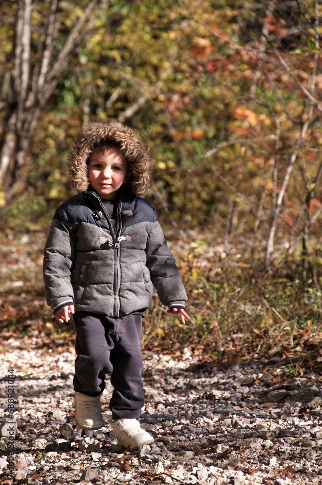 Little toddler walking in the forest Little toddler walking in the forest