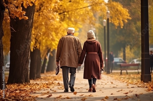 elderly couple walking through the park