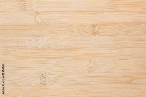 Natural wooden desk texture background, Top view. Abstract top bar table wood bamboo pattern nature. Design wall vintage interior kitchen. Bamboo skin cutting board empty for displaying products. photo