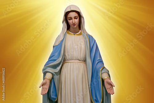 Wallpaper Mural Statue of Our lady of grace virgin Mary with beautiful abstract golden colored background and wallpaper in sweet color. at Thailand. Torontodigital.ca