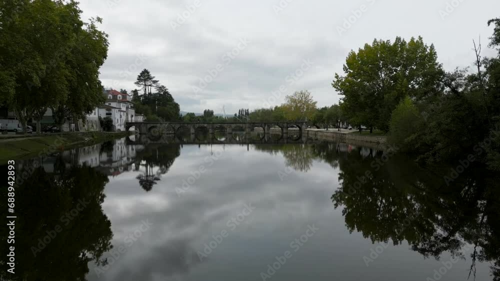 Aerial pullback above river from roman bridge of Aquae Flaviae, Chaves Vila Real Portugal Aerial pullback above river from roman bridge of Aquae Flaviae, Chaves Vila Real Portugal
