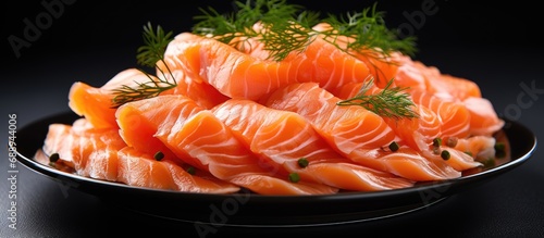 Smoked salmon slices on a plate.