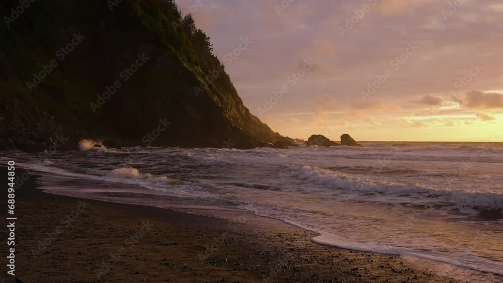 Waves Washing Up Pebble Shore Of Tropical Beach During Sunset. Slow Motion Waves Washing Up Pebble Shore Of Tropical Beach During Sunset. Slow Motion