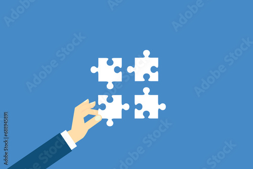 Teamwork. Putting a puzzle together
