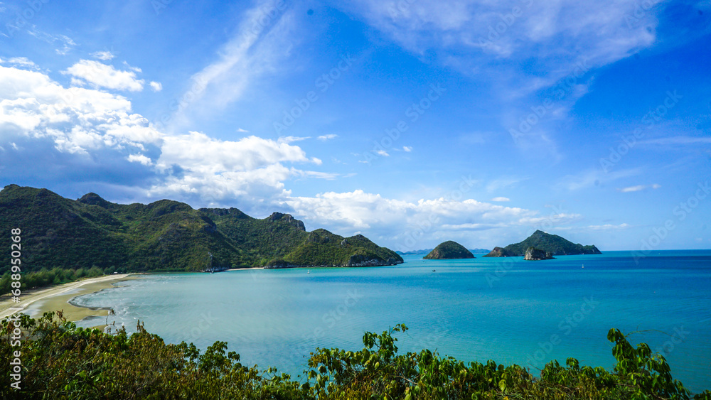 Group of Ship resting on the sea in Beach. Top view of Ban Bang Pu Beach beautiful of long beach with blue-green sea with the hill and blue sky background, Prachuap Khiri Khan, Thailand.