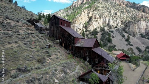 Bayhorse Mine and ghost town in Idaho Mountains- aerial view of mill with mountain peaks photo