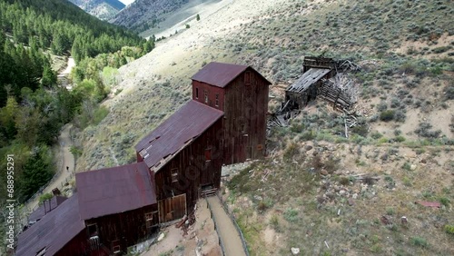 Rusted historic Ruins of Bayhorse Mine and Mill in Idaho Mountains photo