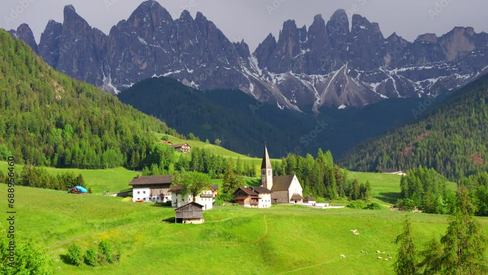 Pan across scenic meadow of Val di Funes and Odle Mountains, Dolomites, Italy Pan across scenic meadow of Val di Funes and Odle Mountains, Dolomites, Italy