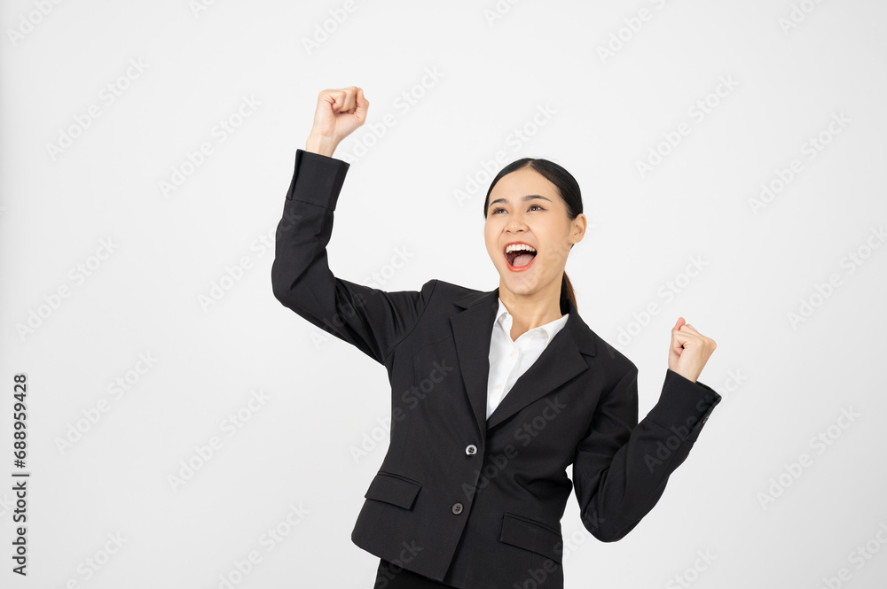 Happy young businesswoman in black outfit with white isolated background. Celebrating pose. Happy young businesswoman in black outfit with white isolated background. Celebrating pose.