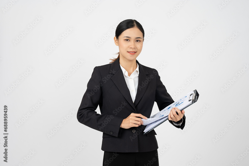 Professional Asian businesswoman with black outfit holding document on white isolated background. Professional Asian businesswoman with black outfit holding document on white isolated background.