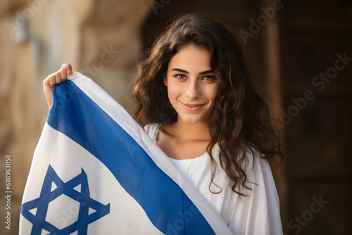 Patriotic jewish young girl with flag of Israel photo