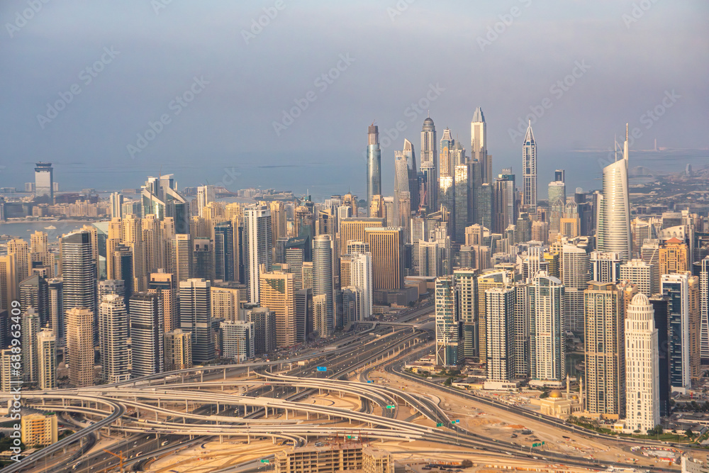 A helicopter view of Dubai Marina, with Sheikh zayed road passing through in the middle.
