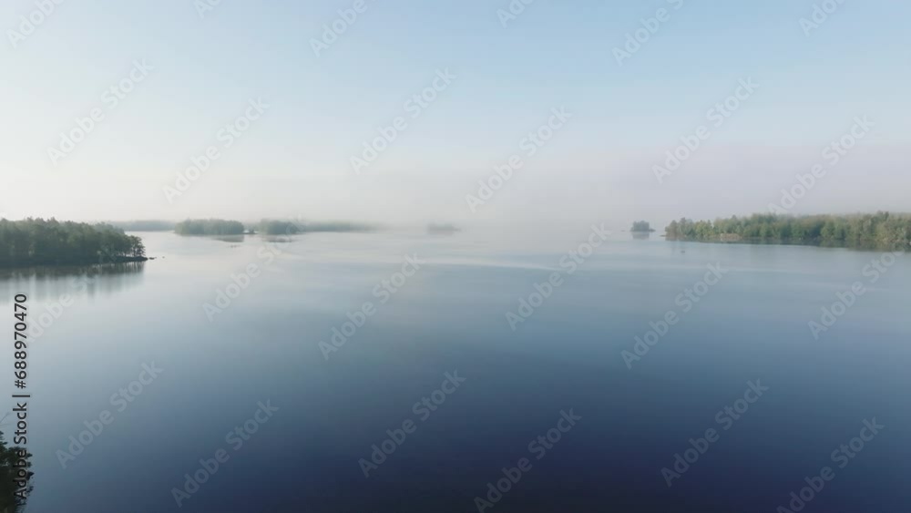 Amazing view of lake in fog and blue sky Amazing view of lake in fog and blue sky