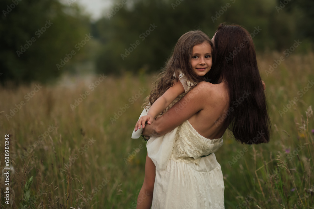 In nature's embrace, a girl finds comfort with her mother. As mental health issues rise, nature's therapy becomes evident. In nature's embrace, a girl finds comfort with her mother. As mental health issues rise, nature's therapy becomes evident.