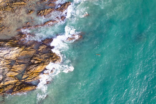 Aerial view drone shot of Tropical seashore in Phuket island thailand,Beautiful crashing waves sea landscape background