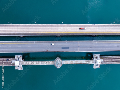 Aerial top view drone shot of bridge with cars on bridge road image transportation background concept,Aerial view of sarasin bridge in Phuket Thailand transportation background,Top view