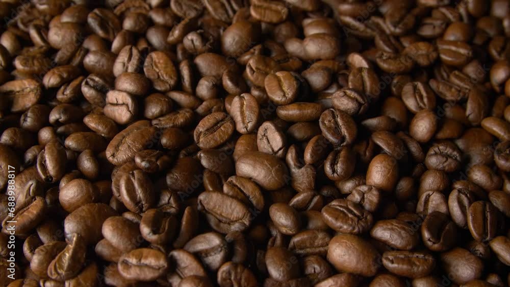 Fragrant coffee beans close-up in motion. Videos for restaurants and cafes Fragrant coffee beans close-up in motion. Videos for restaurants and cafes