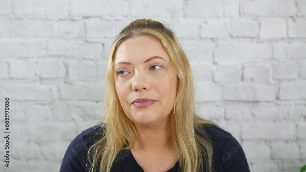 Portrait of a sad pensive lonely blonde woman. The girl is depressed and upset. Portrait of a sad pensive lonely blonde woman. The girl is depressed and upset.