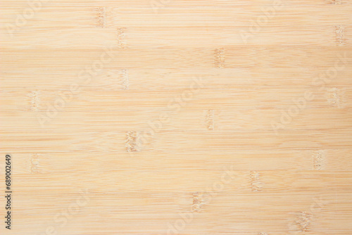 Natural wooden desk texture background, Top view. Abstract top bar table wood bamboo pattern nature. Design wall vintage interior kitchen. Bamboo skin cutting board empty for displaying products. © siripak