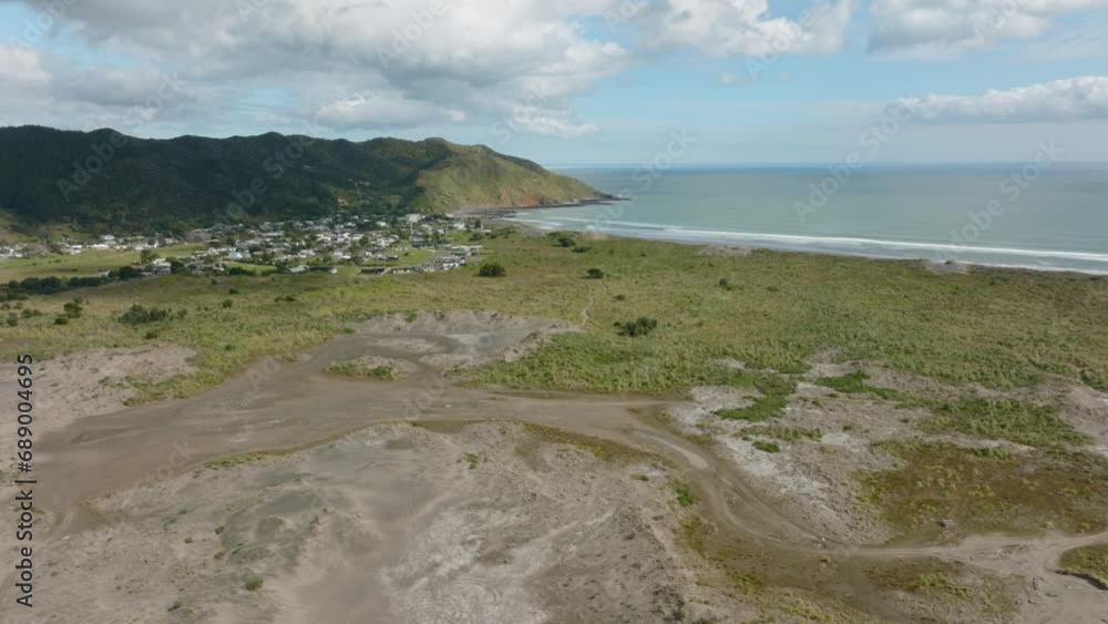 Aerial: Town of Port Waikato and the Waikato River. New Zealand Aerial: Town of Port Waikato and the Waikato River. New Zealand