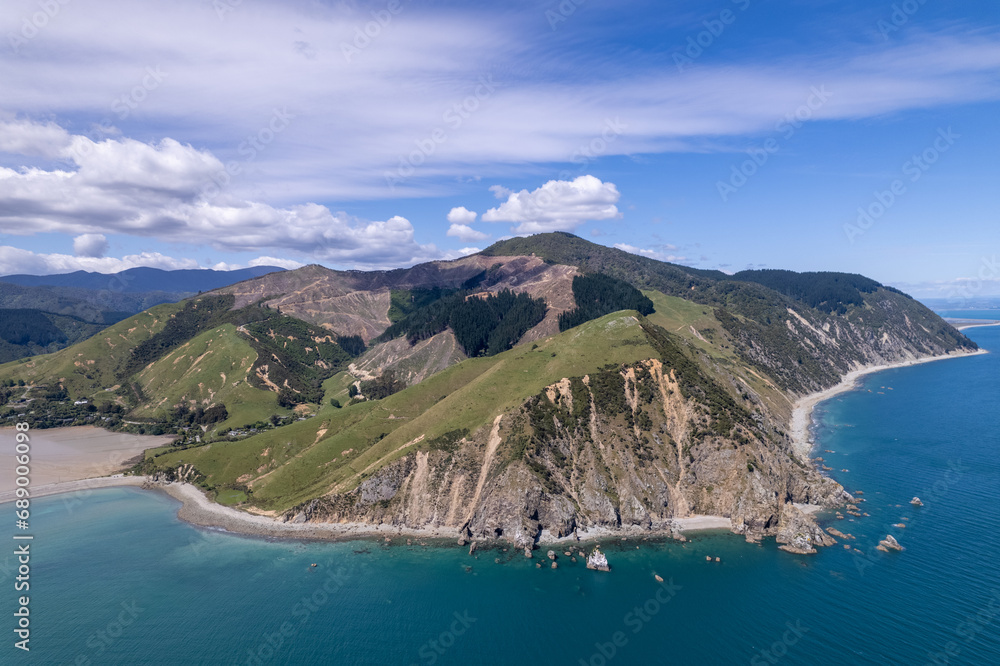 aeriel view of mountain and ocean in new zealand