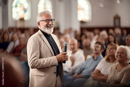 A smiling pastor preaching in a church in front of parishioners. photo