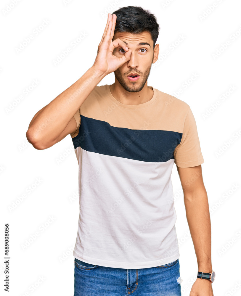 Young handsome man wearing casual clothes doing ok gesture shocked with surprised face, eye looking through fingers. unbelieving expression. Young handsome man wearing casual clothes doing ok gesture shocked with surprised face, eye looking through fingers. unbelieving expression.