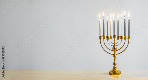 Jewish religious holiday Hanukkah with glittering traditional chandelier menorah on gray background. Hanukkah celebration with menorah. copy space