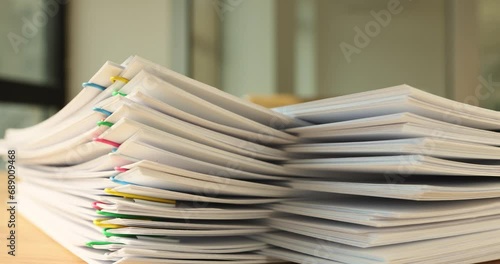 A stack of paper with colored paper clips, timelapse, Organization of document circulation, vertical papers clip photo