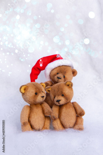 Three cute hand made toy brown bear with Christmas Santa hat