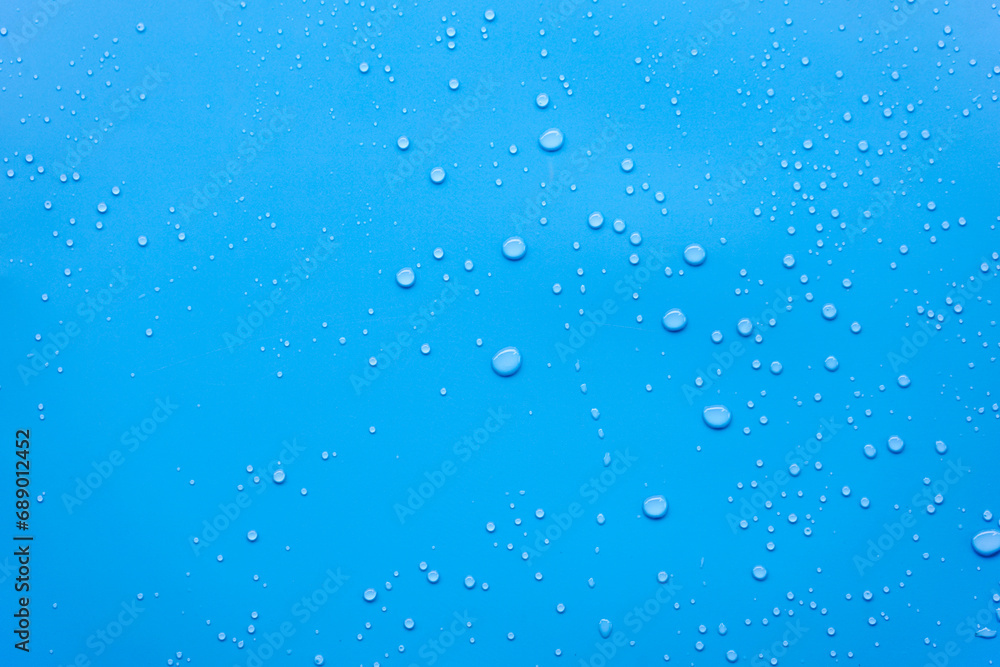 Water or rain drops on blue background Water or rain drops on blue background