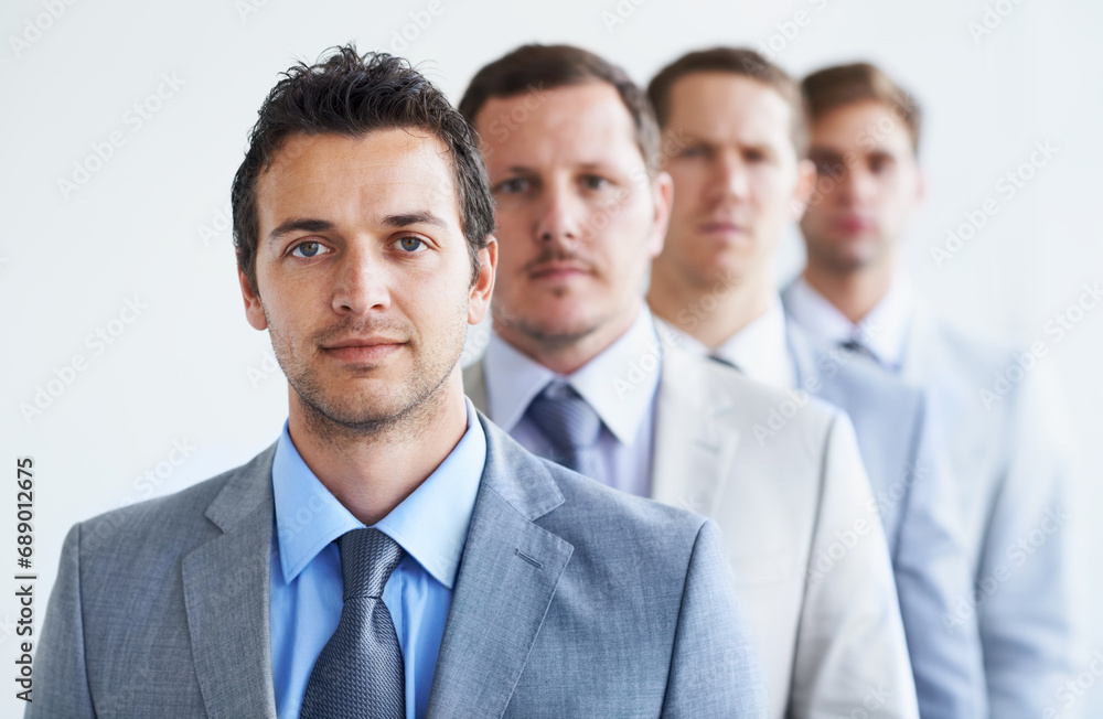 Men, portrait and serious for future finance career, standing and ready for job interview. Worker, corporate accountant in suit or professional in workplace, colleagues in background and confident Men, portrait and serious for future finance career, standing and ready for job interview. Worker, corporate accountant in suit or professional in workplace, colleagues in background and confident