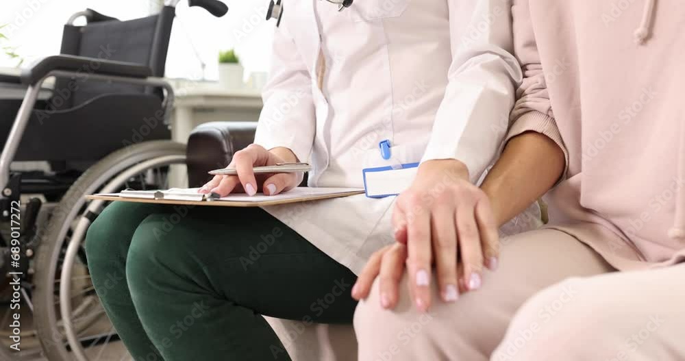 Doctor comfortingly strokes patient hand. Psychological assistance to cancer patients concept Doctor comfortingly strokes patient hand. Psychological assistance to cancer patients concept