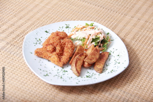 Fried chicken combined with delicious fried potatoes.