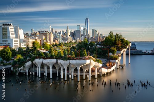 View of downtown Manhattan with the Little Island public elevated park in the foreground. New York City cityscape before the sunset. photo