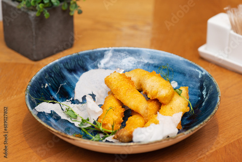 Fried squid tempura in a restaurant, Asian cuisine.