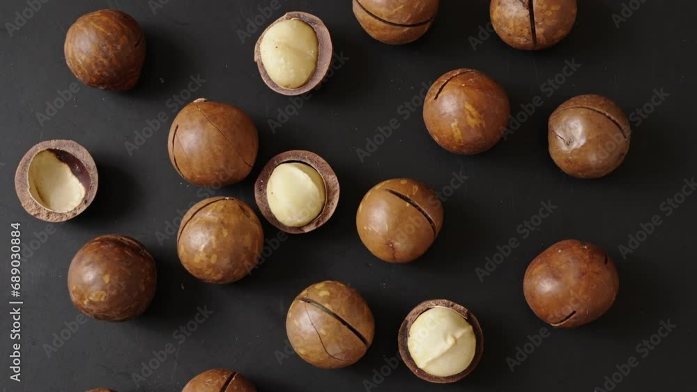 custom made wallpaper toronto digitalCloseup of macadamia nuts on black background.