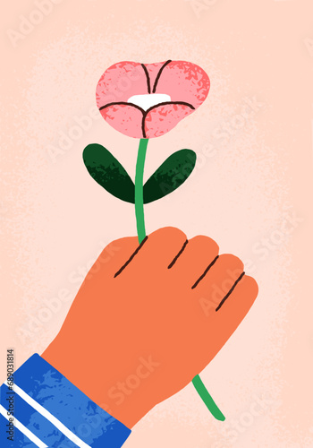 Spring flower in kids hand, greeting card. Child holding blooming gift for Mo...