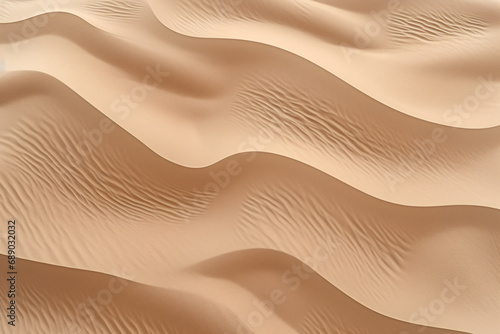 Aerial view of sand dunes in the desert, sand texture background seen from above © Dennis