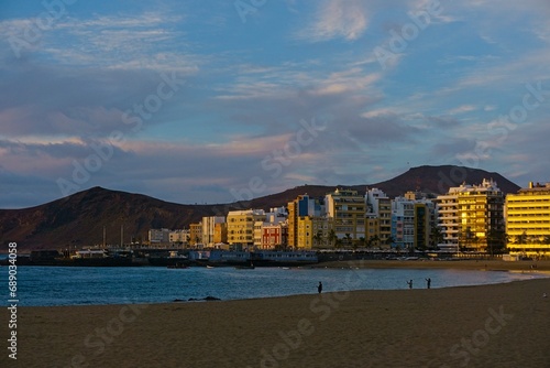 Las Palmas de Gran Canaria, Spain: Sunset over Las Canteras beach and Las Palmas buildings skyline
