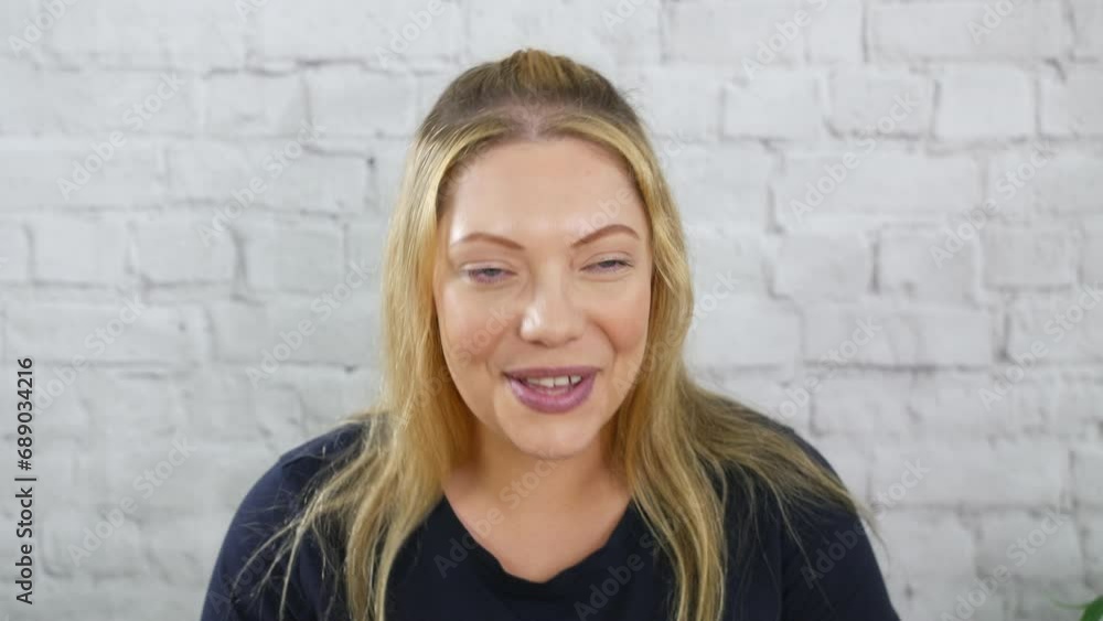 Portrait of a laughing funny happy blonde woman smiling Portrait of a laughing funny happy blonde woman smiling