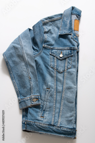 Side View of Blue Truckers Denim Jacket Isolated on White Background