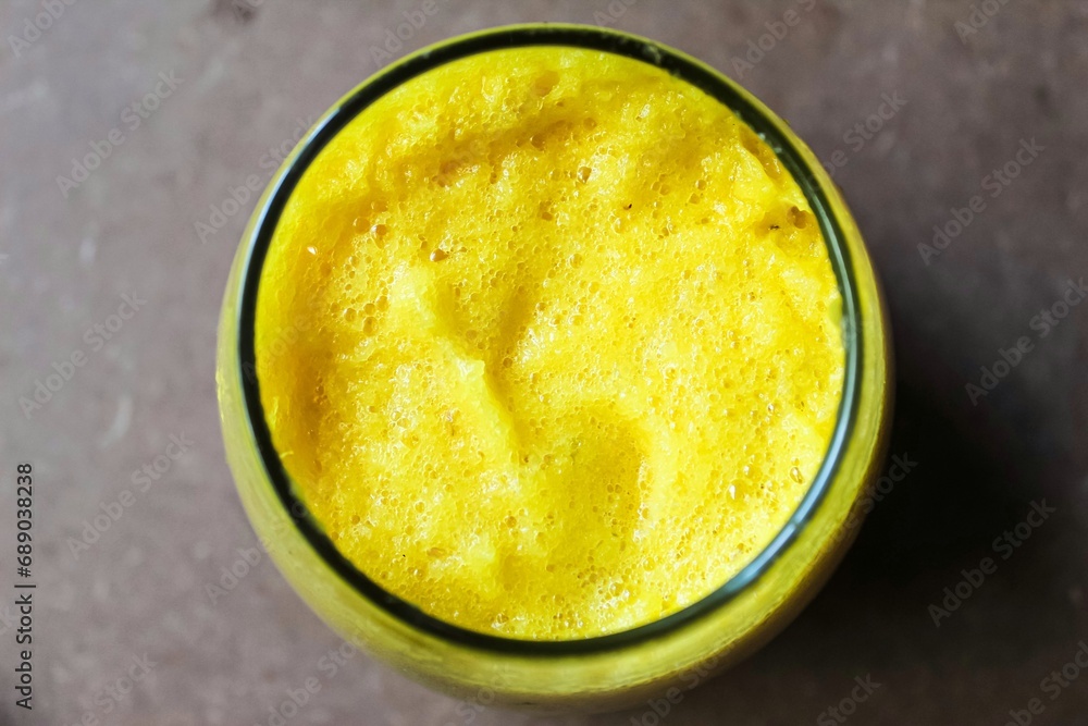 a glass of pineapple juice