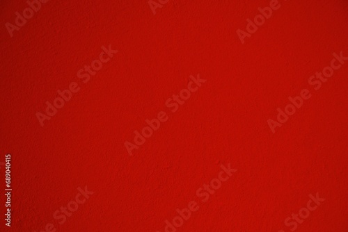 Red textured concrete wall background.