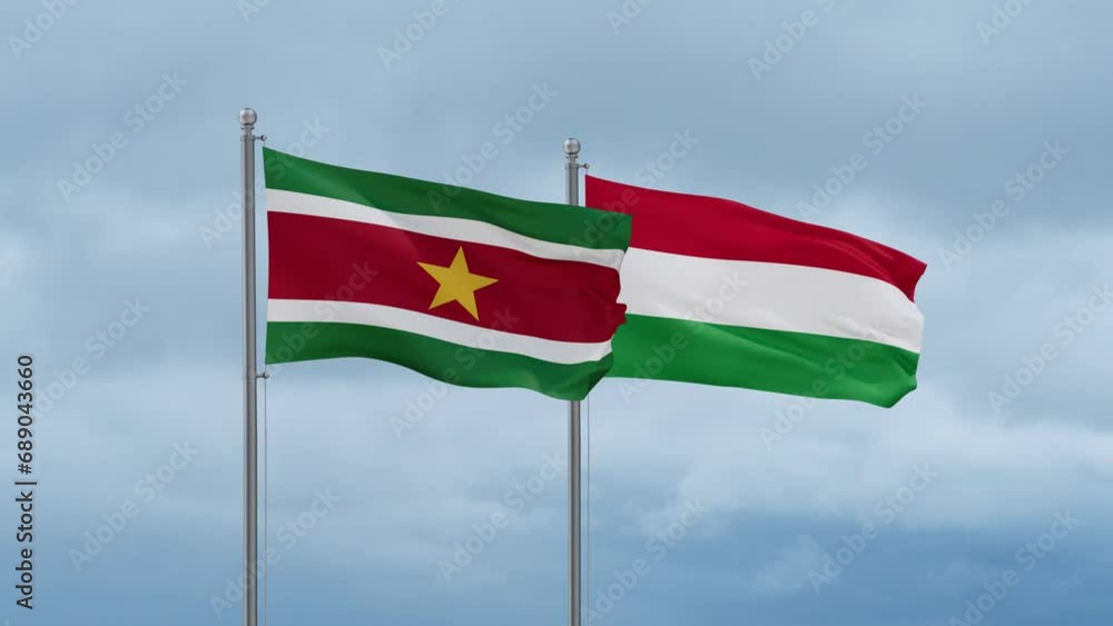 Hungary flag and Suriname flag waving together on cloudy sky, endless seamless loop, two country relations concept Hungary flag and Suriname flag waving together on cloudy sky, endless seamless loop, two country relations concept