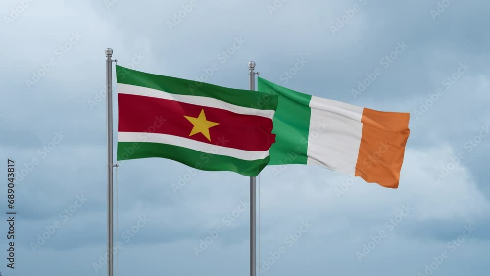 Ireland flag and Suriname flag waving together on cloudy sky, endless seamless loop, two country relations concept Ireland flag and Suriname flag waving together on cloudy sky, endless seamless loop, two country relations concept
