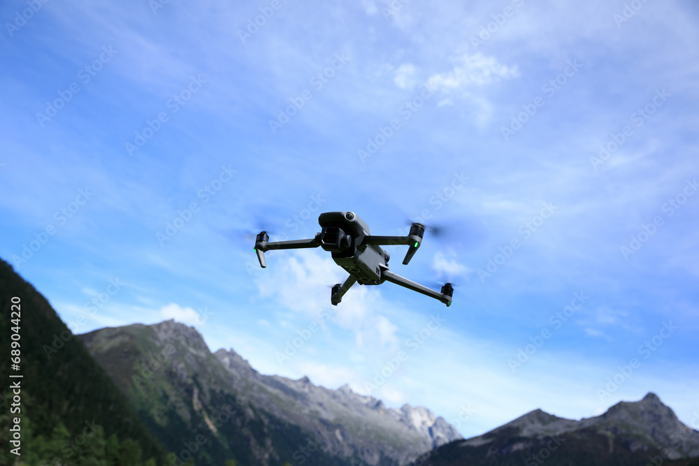 Flying drone in high altitude mountains Flying drone in high altitude mountains