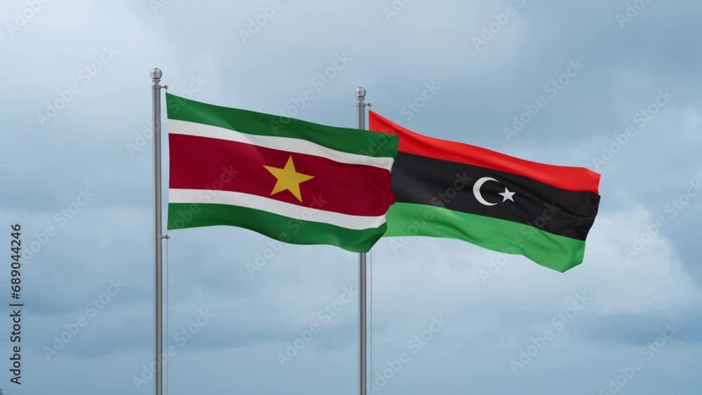 Libya and Suriname flag waving together on cloudy sky, endless seamless loop, two country cooperation concept Libya and Suriname flag waving together on cloudy sky, endless seamless loop, two country cooperation concept